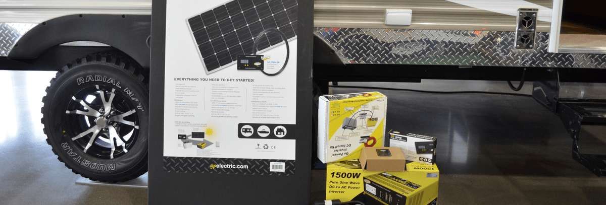 Go Power! solar kit and inverter boxes next to a trailer